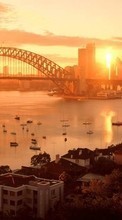 Scaricare immagine Landscape, Cities, Bridges, Sunset, Sun sul telefono gratis.